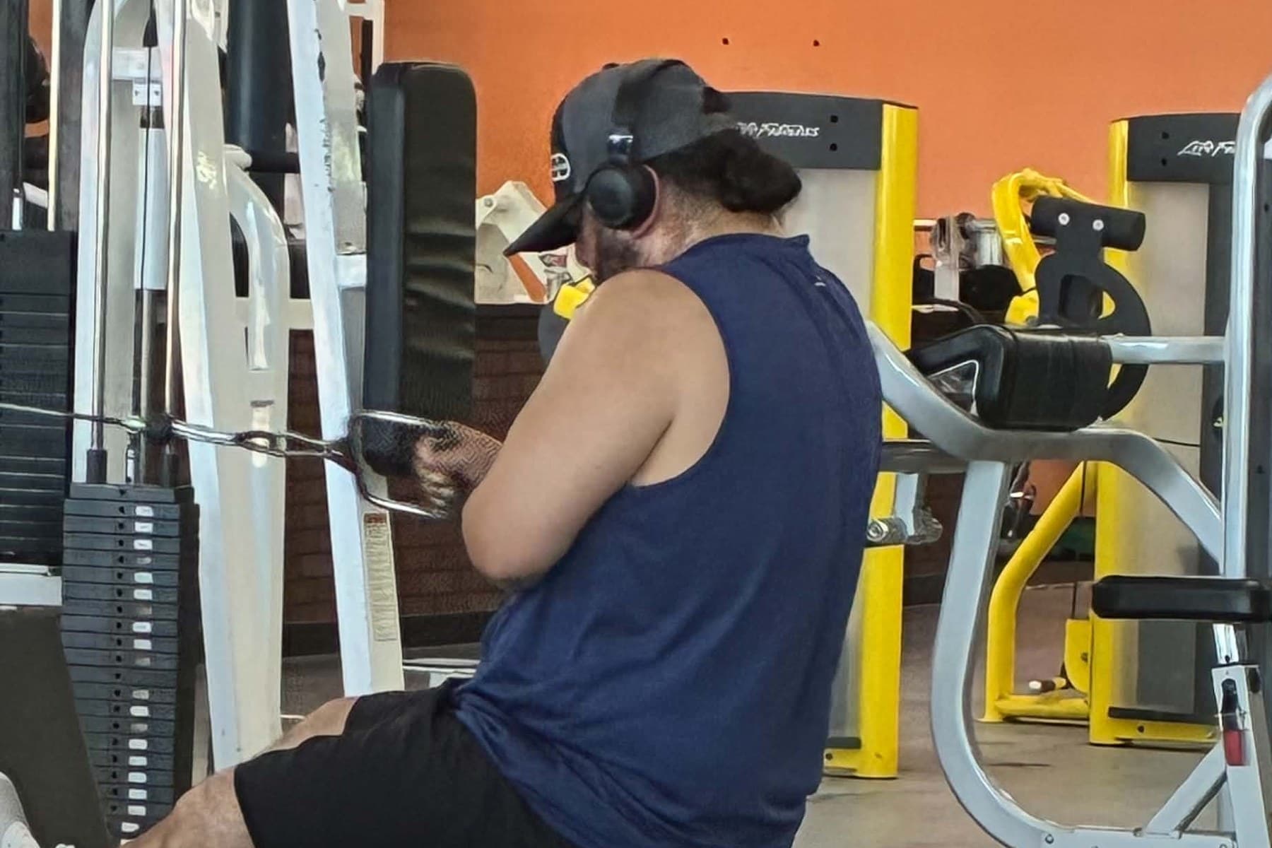 Member training on the chest press at Absolute Fitness
